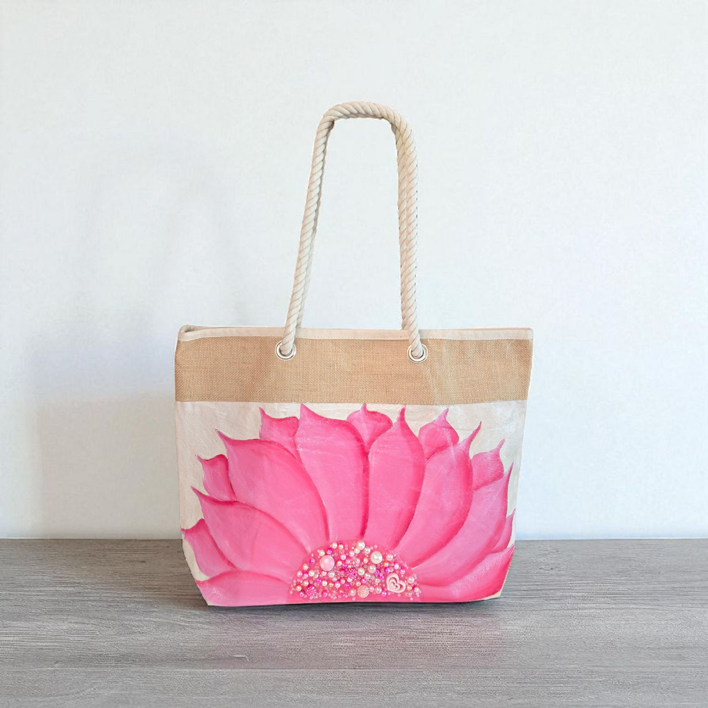 Hand-painted rope handle tote bag featuring a bright pink sunflower with bead embellishments.