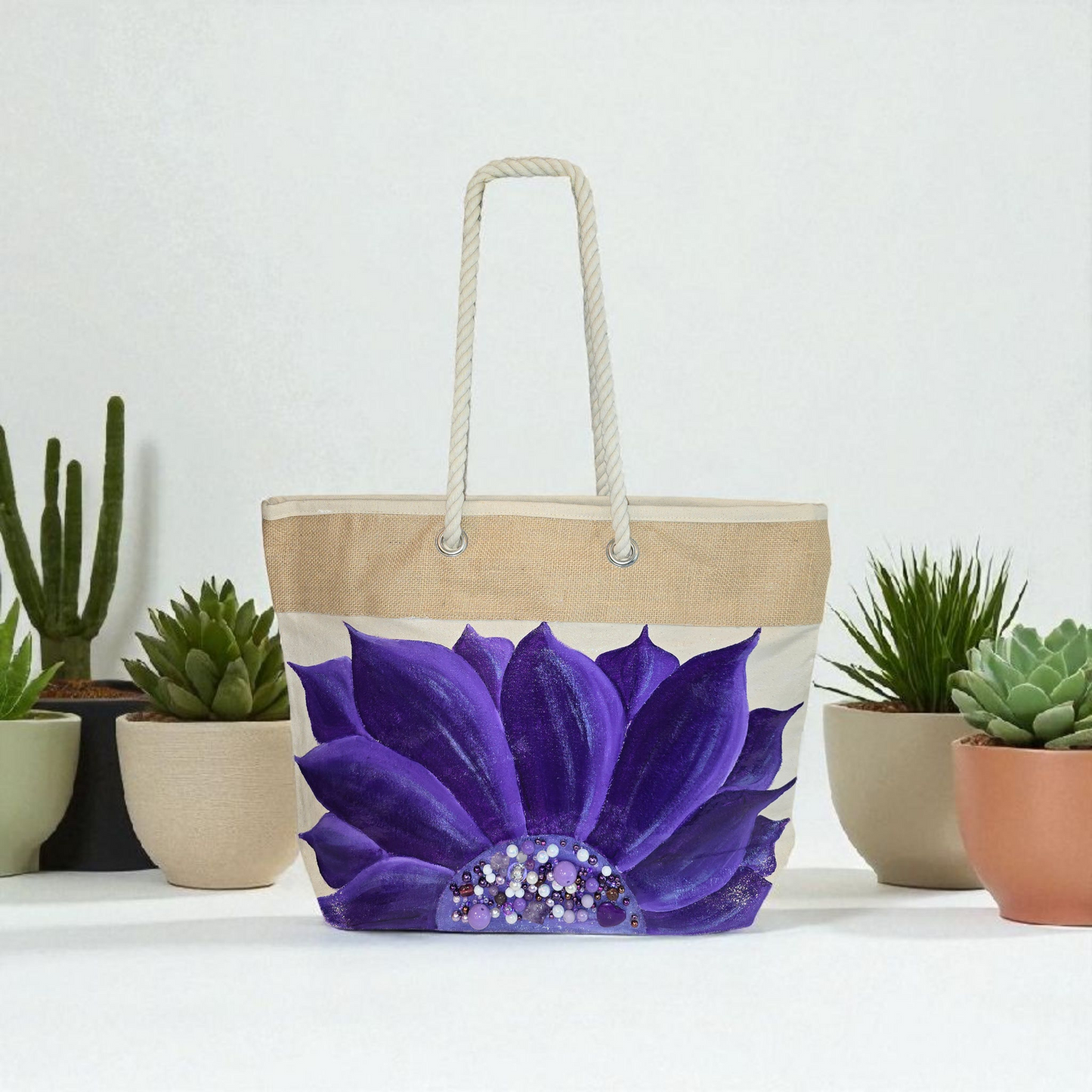Hand-painted rope handle tote bag featuring a vibrant purple sunflower with bead embellishments.
