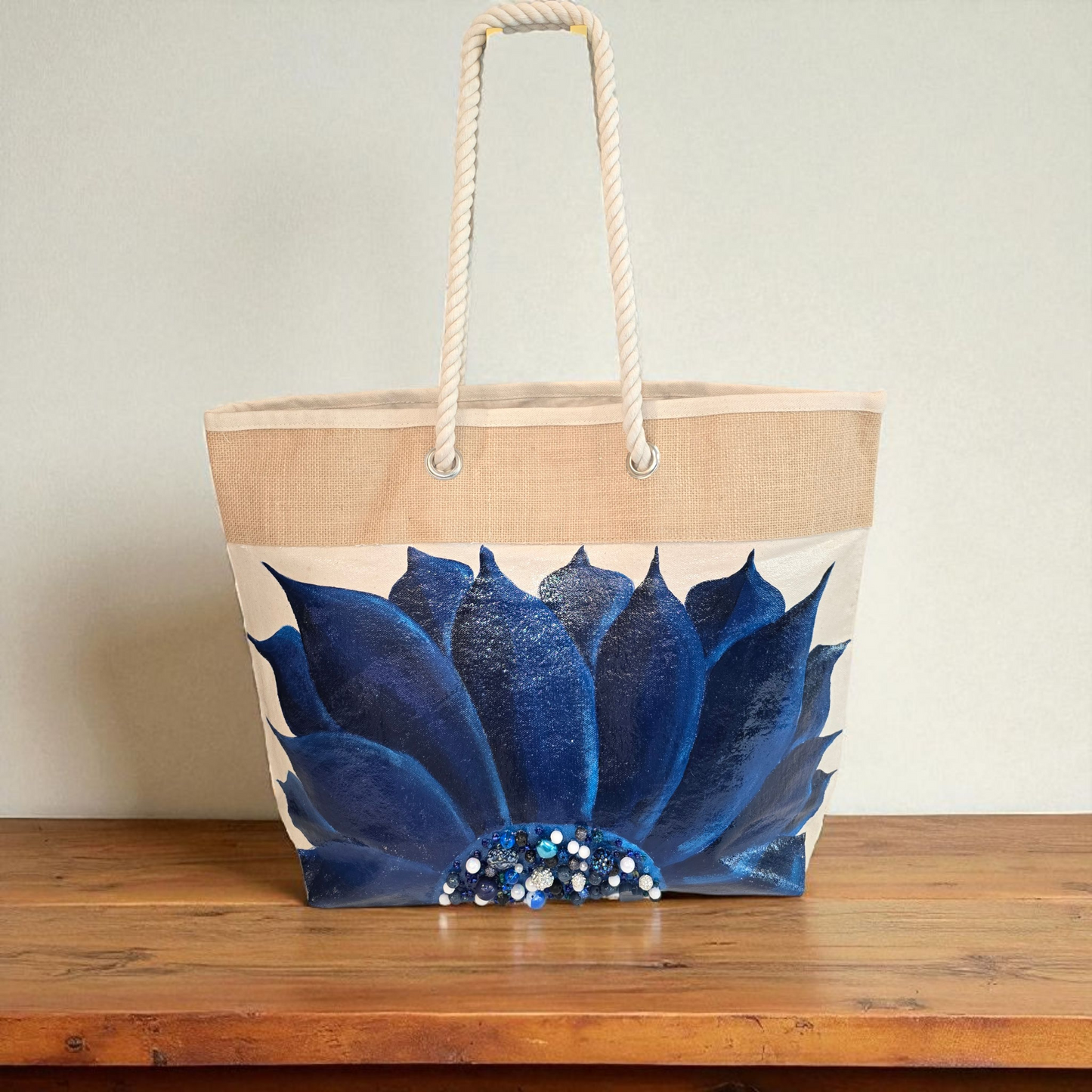 Hand-painted rope handle tote bag with a deep blue sunflower and bead embellishments.
