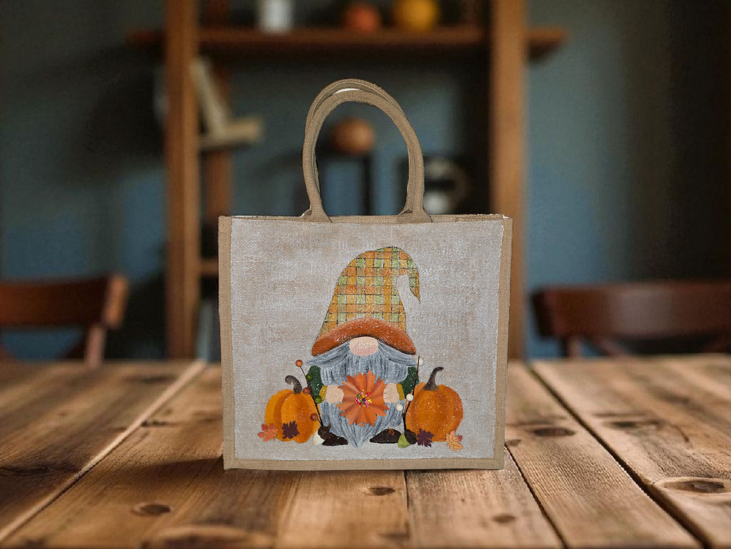 Hand-painted Fall Gnome tote bag with sunflowers, acorns, and berries on metallic jute background