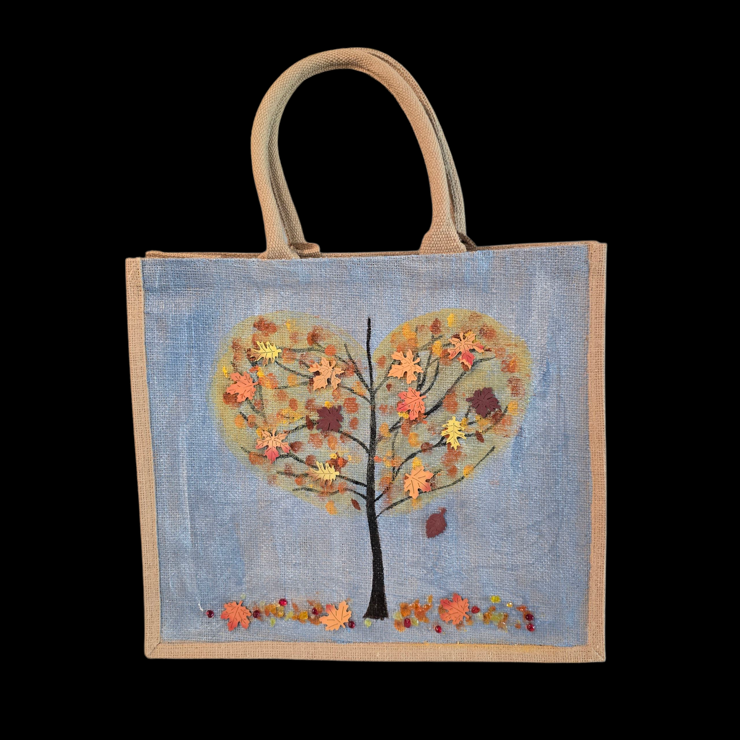 Hand-painted jute tote featuring a heart-shaped fall tree with colorful leaves in red, orange, and gold; painted on a pale blue metallic background with beads and wooden embellishments
