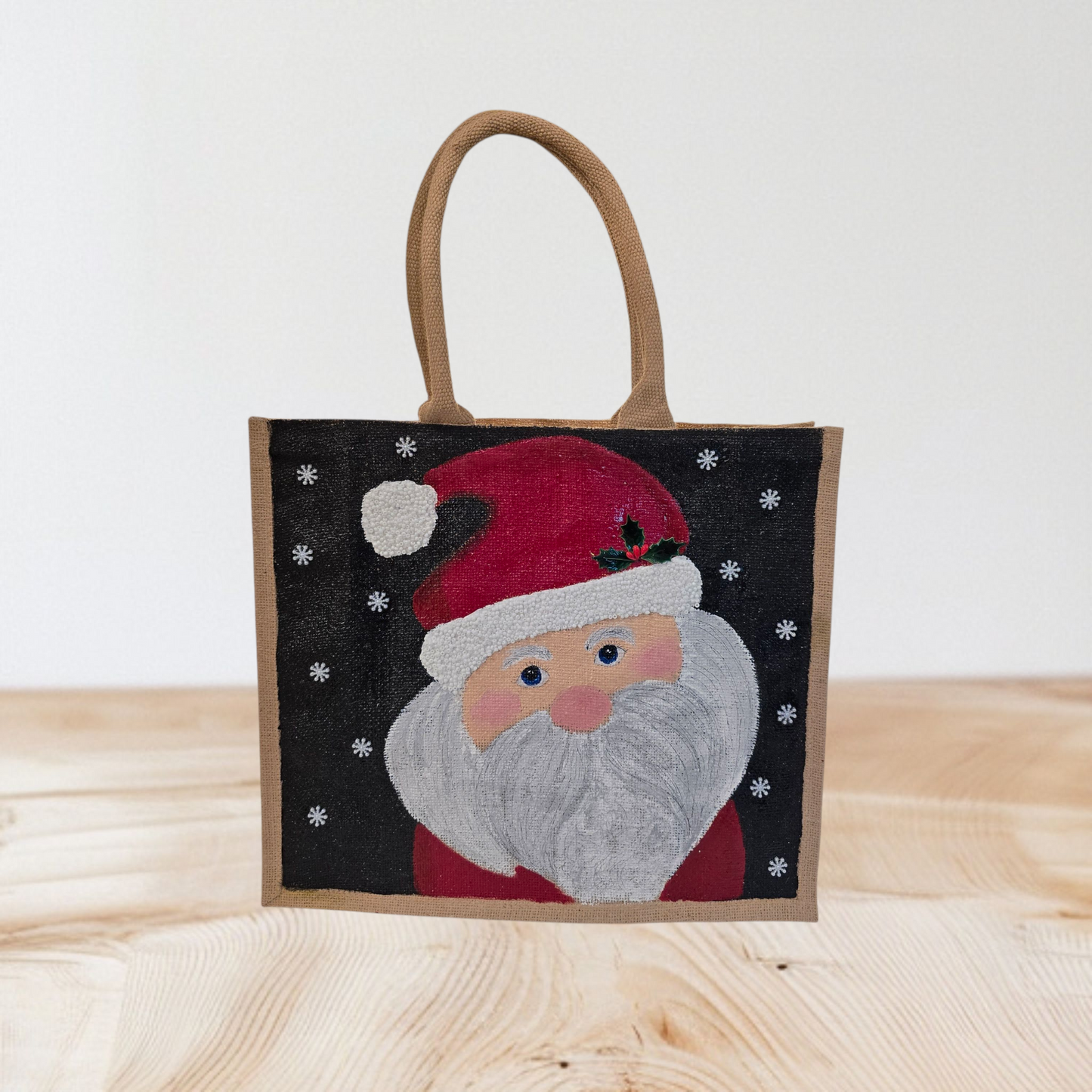 Hand-painted classic Santa portrait on black snowy background, Jolly Santa face tote with holly detail and textured beard, Artisan Santa holiday tote, lined jute with long handles