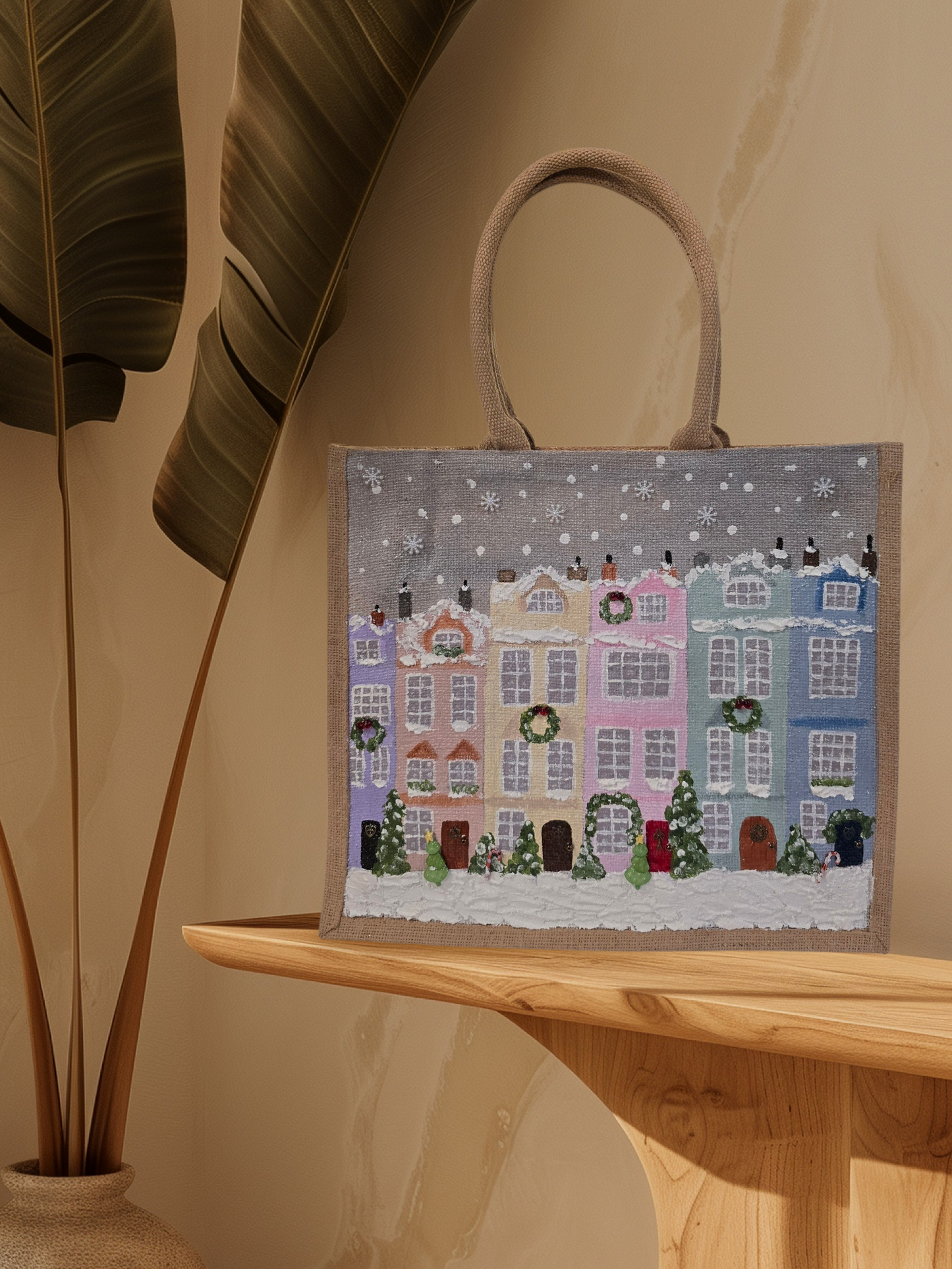 Hand-painted pastel gingerbread row houses in the snow on jute tote, Holiday village street artwork on artisan lined tote, Pastel Christmas houses tote with wreaths and snowfall