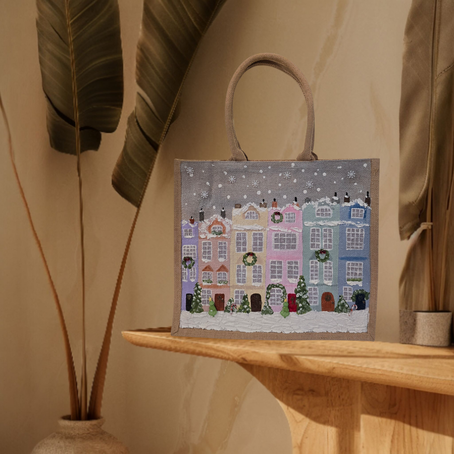 Hand-painted pastel gingerbread row houses in the snow on jute tote, Holiday village street artwork on artisan lined tote, Pastel Christmas houses tote with wreaths and snowfall