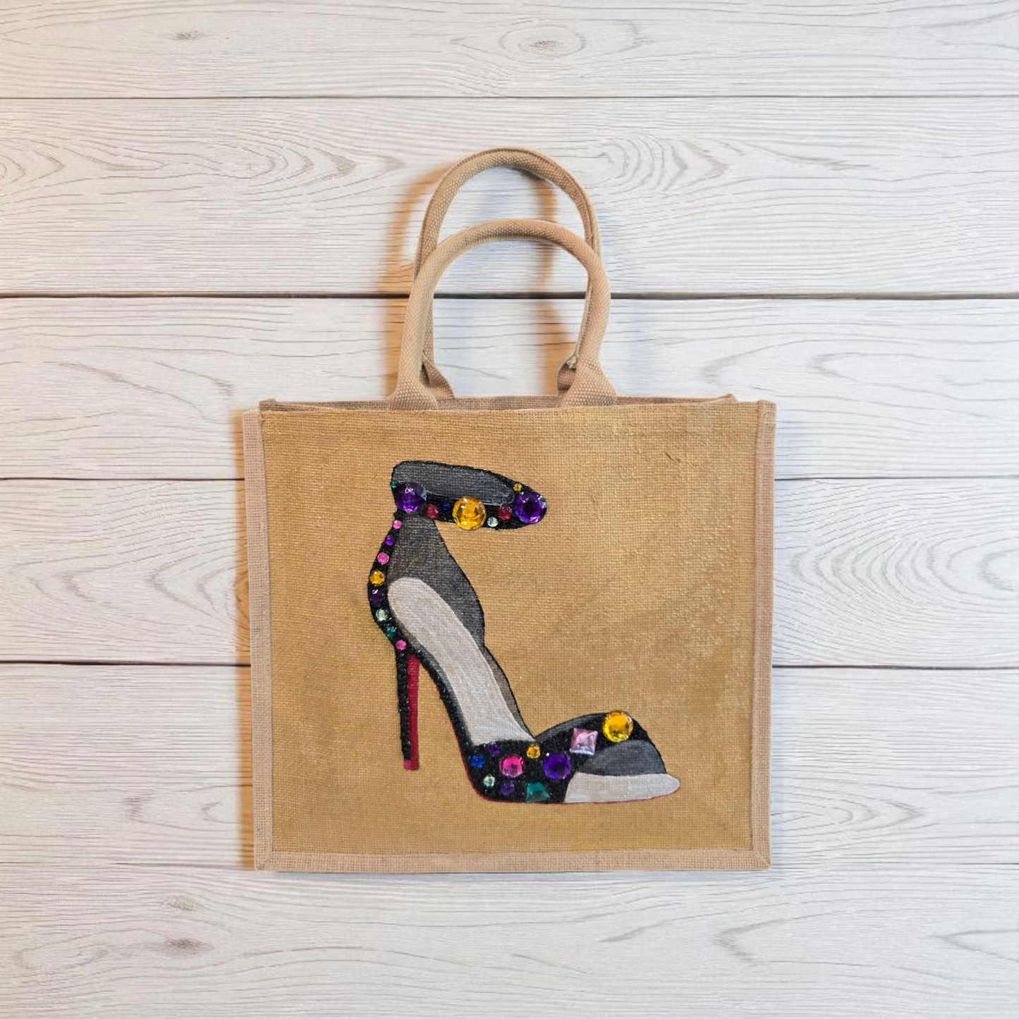 Hand-painted black stiletto tote bag with gold jeweled accents on natural jute background