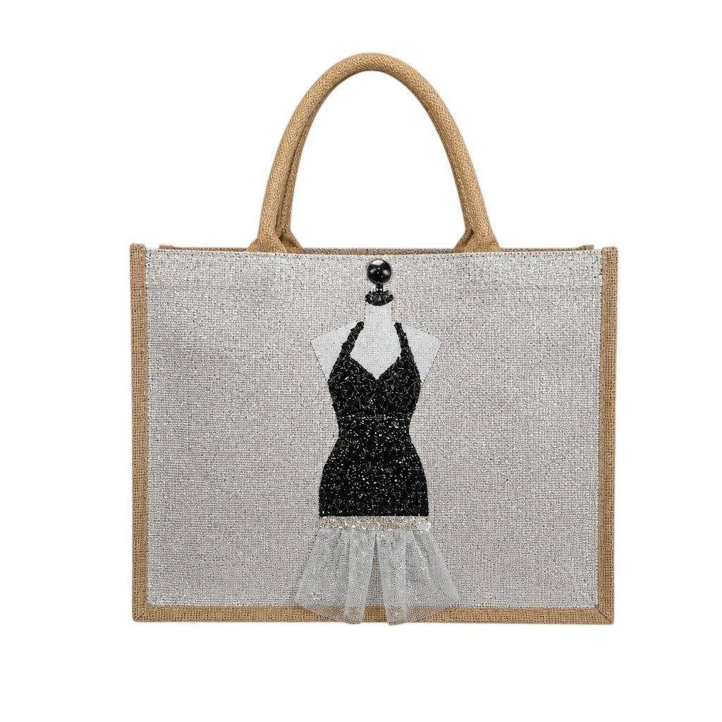 Hand-painted jute tote bag featuring a black glitter evening dress design on a mannequin form with sheer tulle accents, black embellishments, and natural burlap handles.