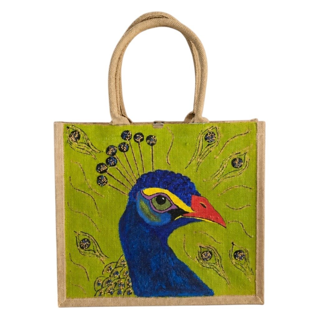 Hand-painted peacock tote bag on natural jute canvas featuring a bold blue peacock portrait with colorful feather accents against a vibrant lime green background, finished with long double handles and a structured rectangular shape.