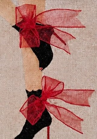 close up of Hand-painted tote bag featuring black stiletto boots with dramatic red ribbon bows and glitter accents on a natural jute handbag.