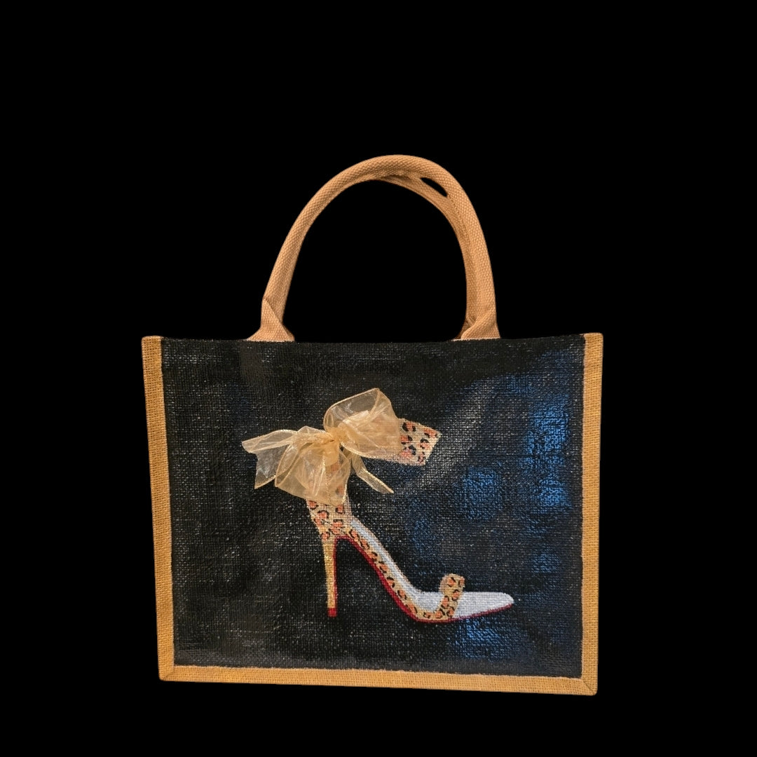 Black jute tote bag with hand-painted copper animal print stilettos and red soles, featuring beaded embellishments.