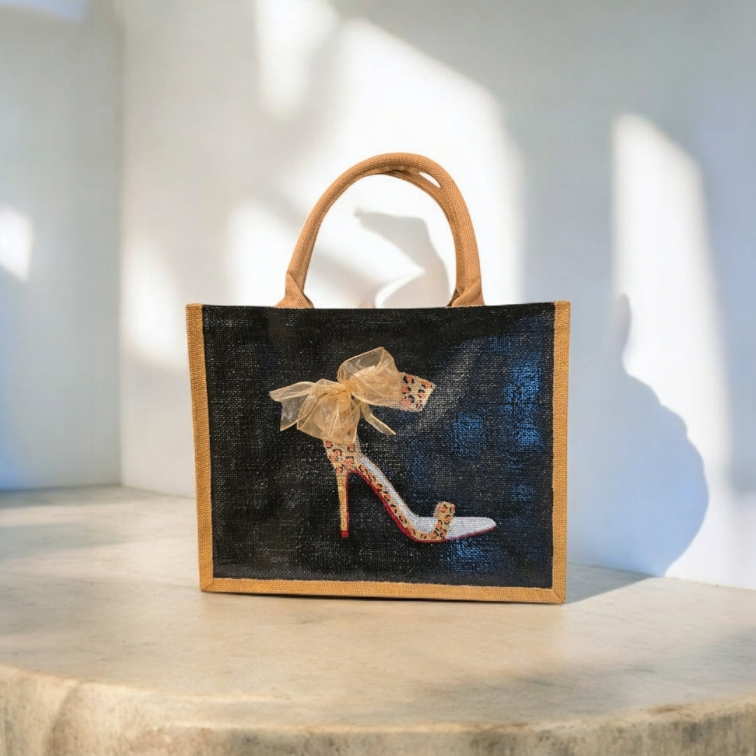 Black jute tote bag with hand-painted copper animal print stilettos and red soles, featuring beaded embellishments.