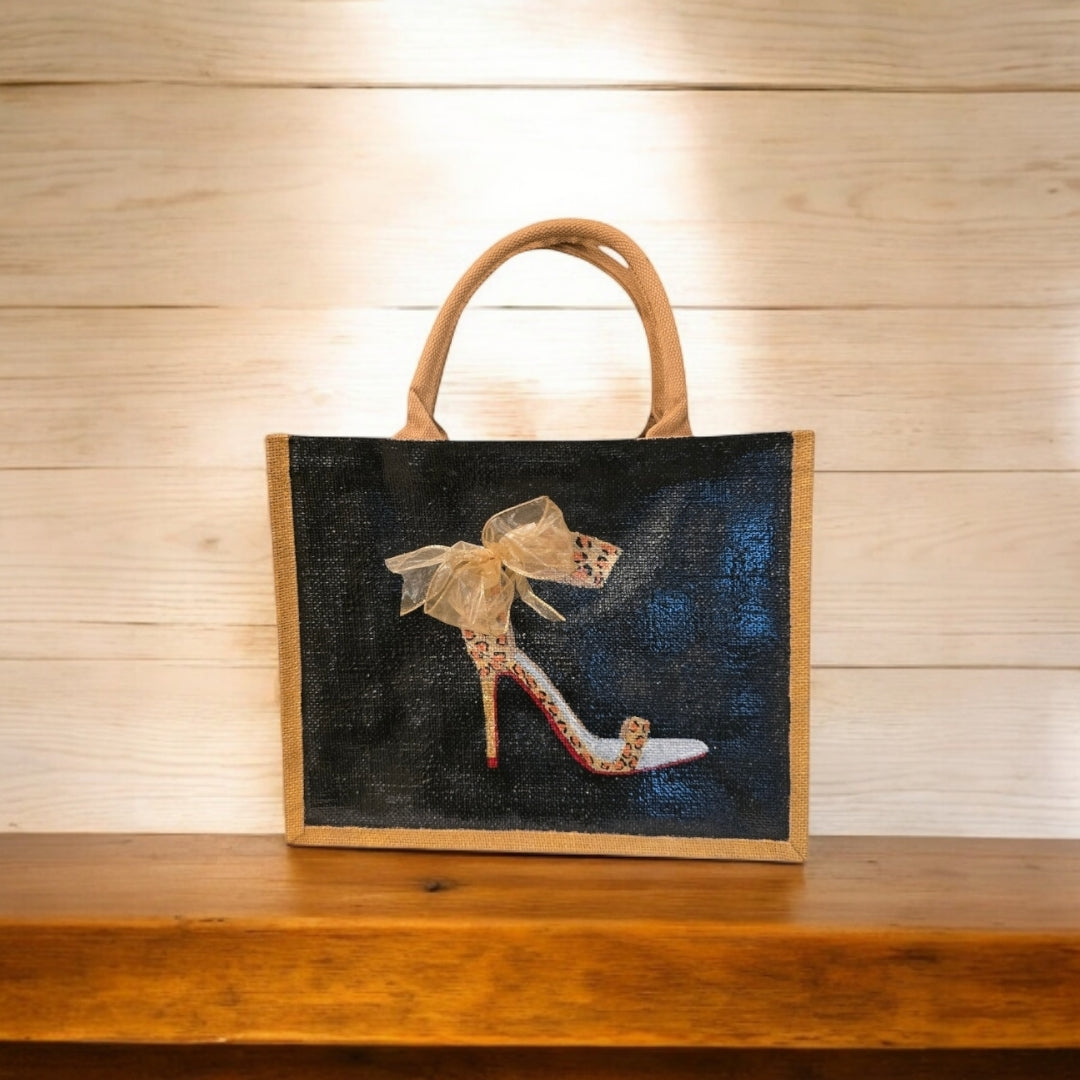 Black jute tote bag with hand-painted copper animal print stilettos and red soles, featuring beaded embellishments.