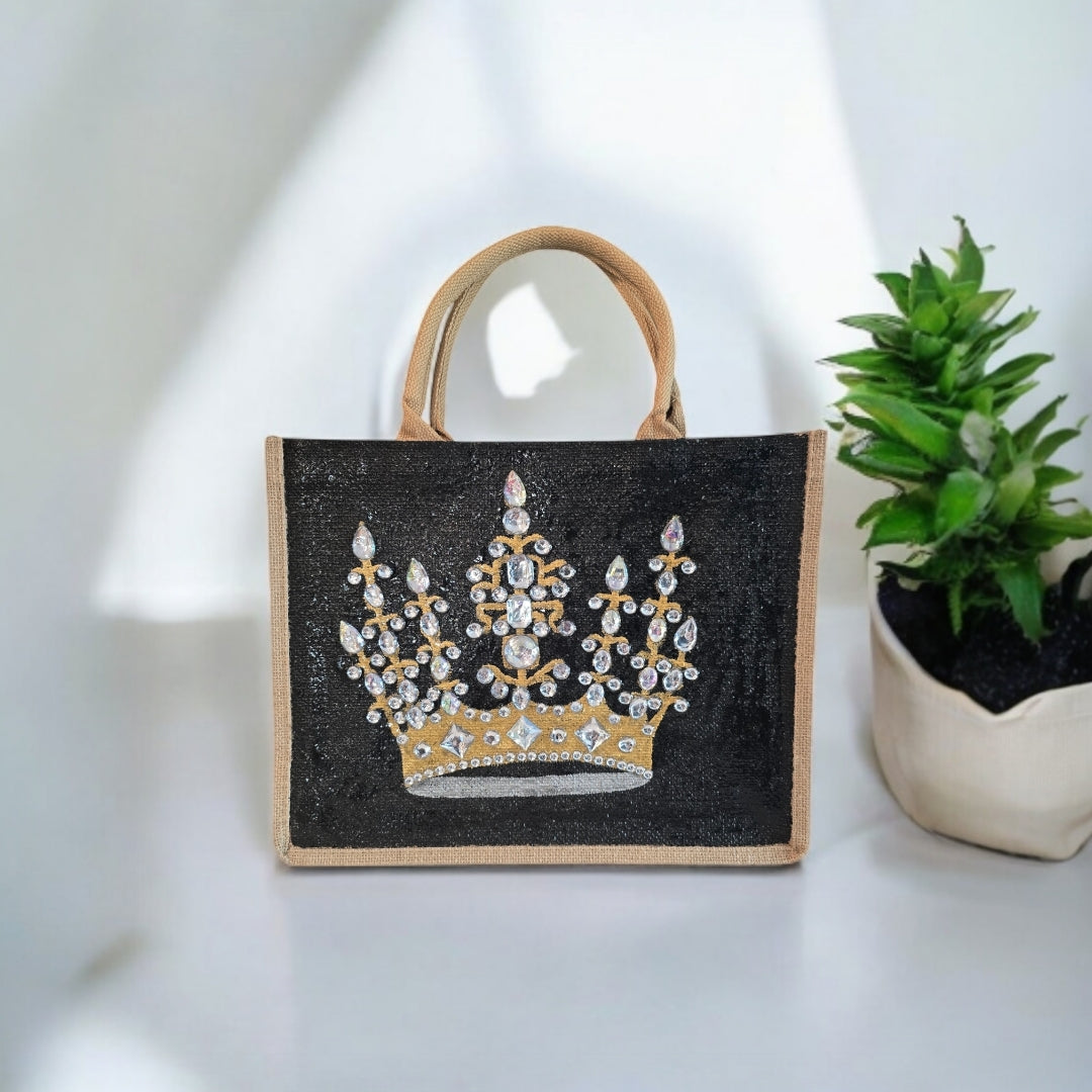 Black jute tote bag with hand-painted gold crown and sparkling beaded accents.