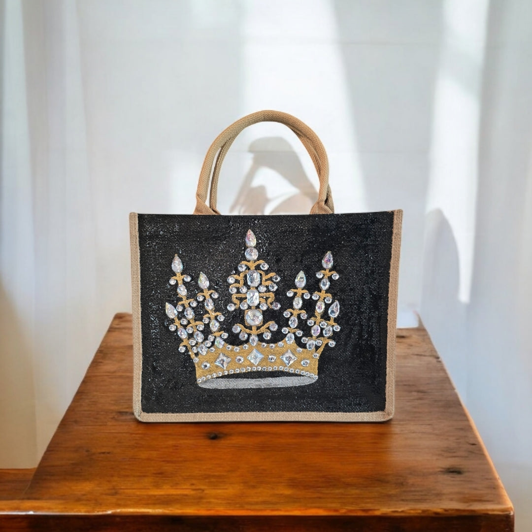 Black jute tote bag with hand-painted gold crown and sparkling beaded accents.