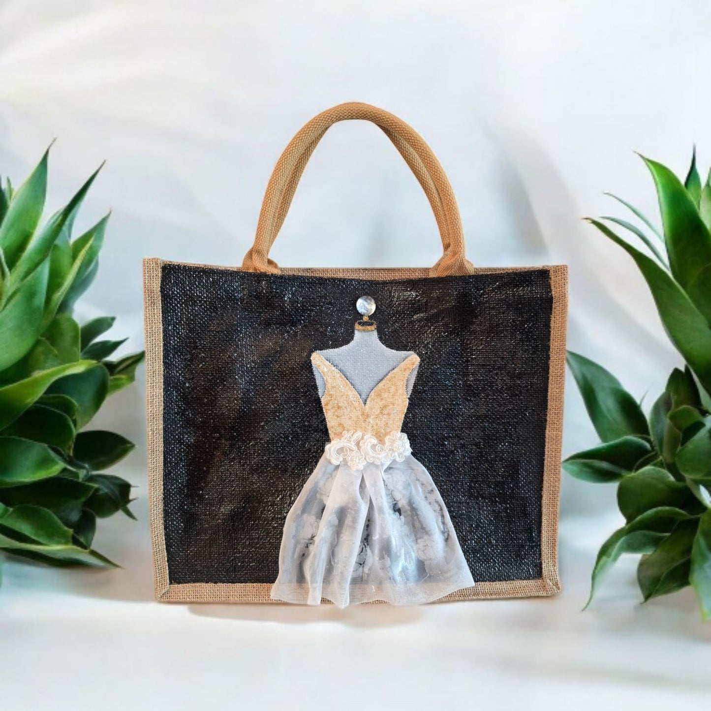 Black jute tote bag with hand-painted white wedding dress design and beaded embellishments.