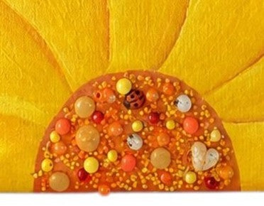 Close Up of Hand-painted rope handle beach tote featuring a large dimensional yellow sunflower design with textured petals and embellished center details on a natural jute and canvas bag with cream rope handles.