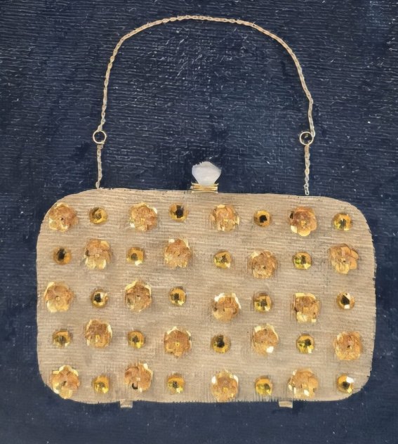 close up of Hand-painted navy blue jute tote bag featuring an embellished vintage-style clutch purse design with sparkling gold jewel accents and dimensional details. Elegant fashion-inspired statement tote with natural jute trim, double handles, and magnetic snap closure. Perfect for dressy occasions, boutique fashion lovers, and unique handmade gift giving.