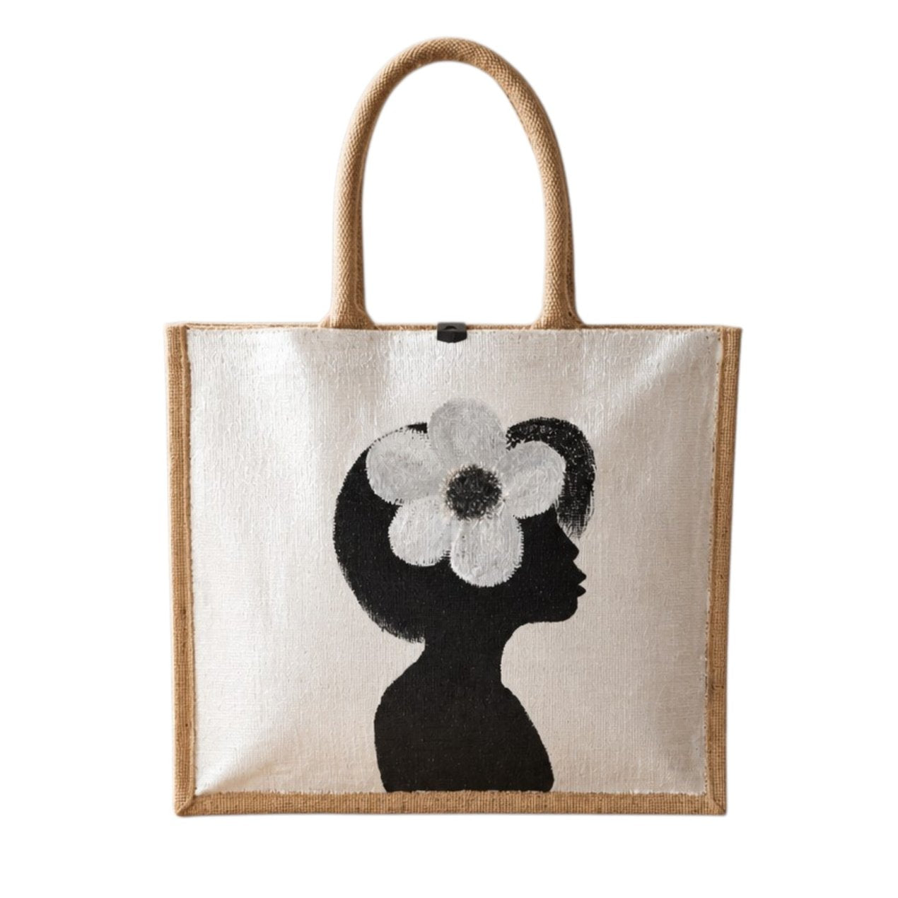 Hand-painted jute tote bag featuring a minimalist black silhouette of a woman in profile with a bold white flower in her hair on a pearl white background. This chic neutral tote includes natural jute handles, a magnetic closure, and modern wearable art styling.