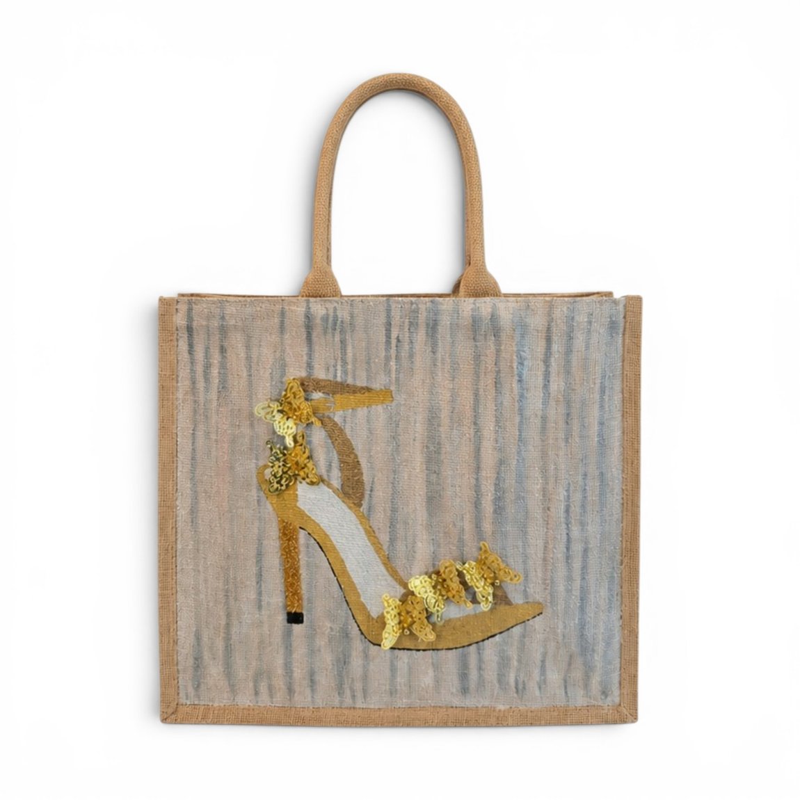 Hand-painted neutral-toned tote bag featuring an elegant gold high-heel sandal embellished with shimmering floral sequins on a soft gray and beige textured background. Stylish wearable art handbag with structured jute handles and sophisticated fashion-inspired design.