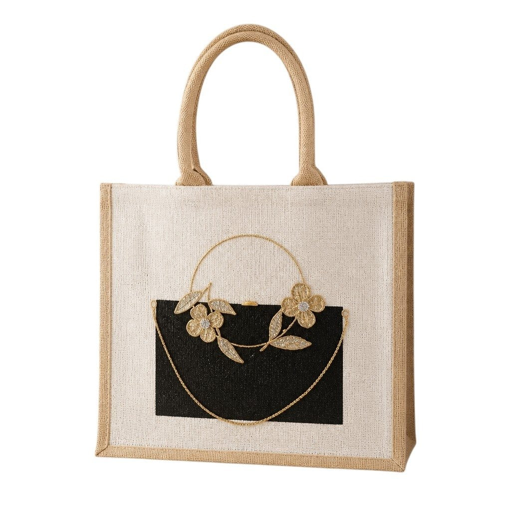 Elegant hand-painted jute tote bag featuring a black rectangular purse design accented with delicate gold floral embellishments, leaves, and a draped gold chain detail. The structured tote has woven natural handles and a sophisticated neutral color palette with artisan-inspired styling.