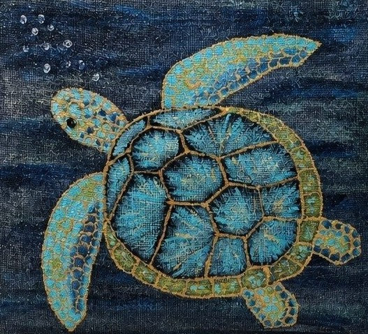 Close up of Hand-painted jute tote bag featuring a blue and turquoise sea turtle swimming underwater against a deep navy ocean background, with natural burlap handles and trim.
