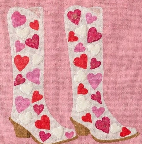 close up of Hand-painted pink jute tote bag featuring white cowboy boots decorated with red, pink, and white heart designs. Romantic western-inspired tote bag with a soft pink background, structured handles, and Valentine-inspired wearable art details.