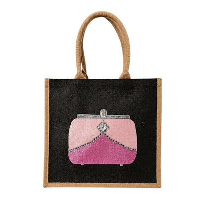 Hand-painted black jute tote bag featuring a chic pink clutch purse design with silver embellishment details, perfect for adding a playful pop of glamour to everyday style.