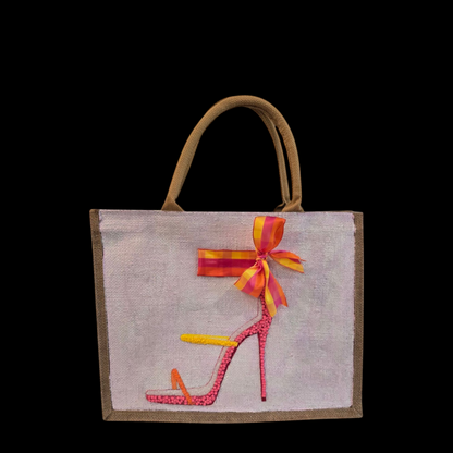 Off white jute tote bag with hand-painted high heel sandals in vibrant colors, accented with bead details.