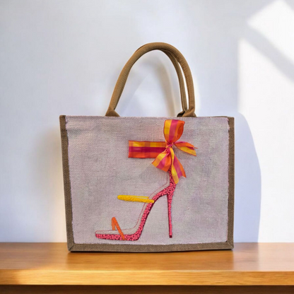 Off white jute tote bag with hand-painted high heel sandals in vibrant colors, accented with bead details.