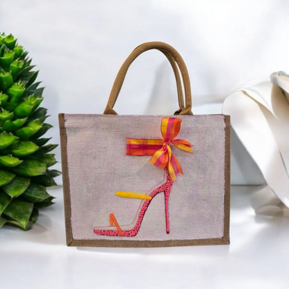 Off white jute tote bag with hand-painted high heel sandals in vibrant colors, accented with bead details.