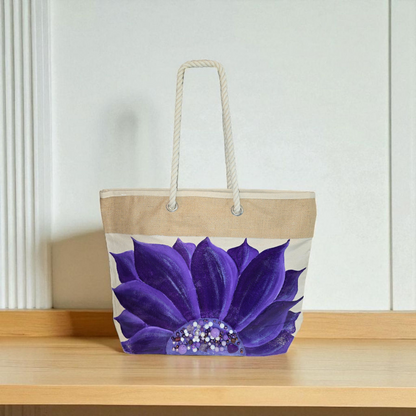 Hand-painted rope handle tote bag featuring a vibrant purple sunflower with bead embellishments.