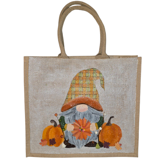 Hand-painted Fall Gnome tote bag with sunflowers, acorns, and berries on metallic jute background