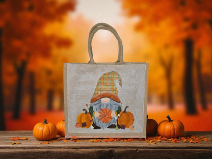 Hand-painted Fall Gnome tote bag with sunflowers, acorns, and berries on metallic jute background