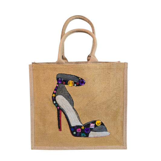Hand-painted black stiletto tote bag with gold jeweled accents on natural jute background