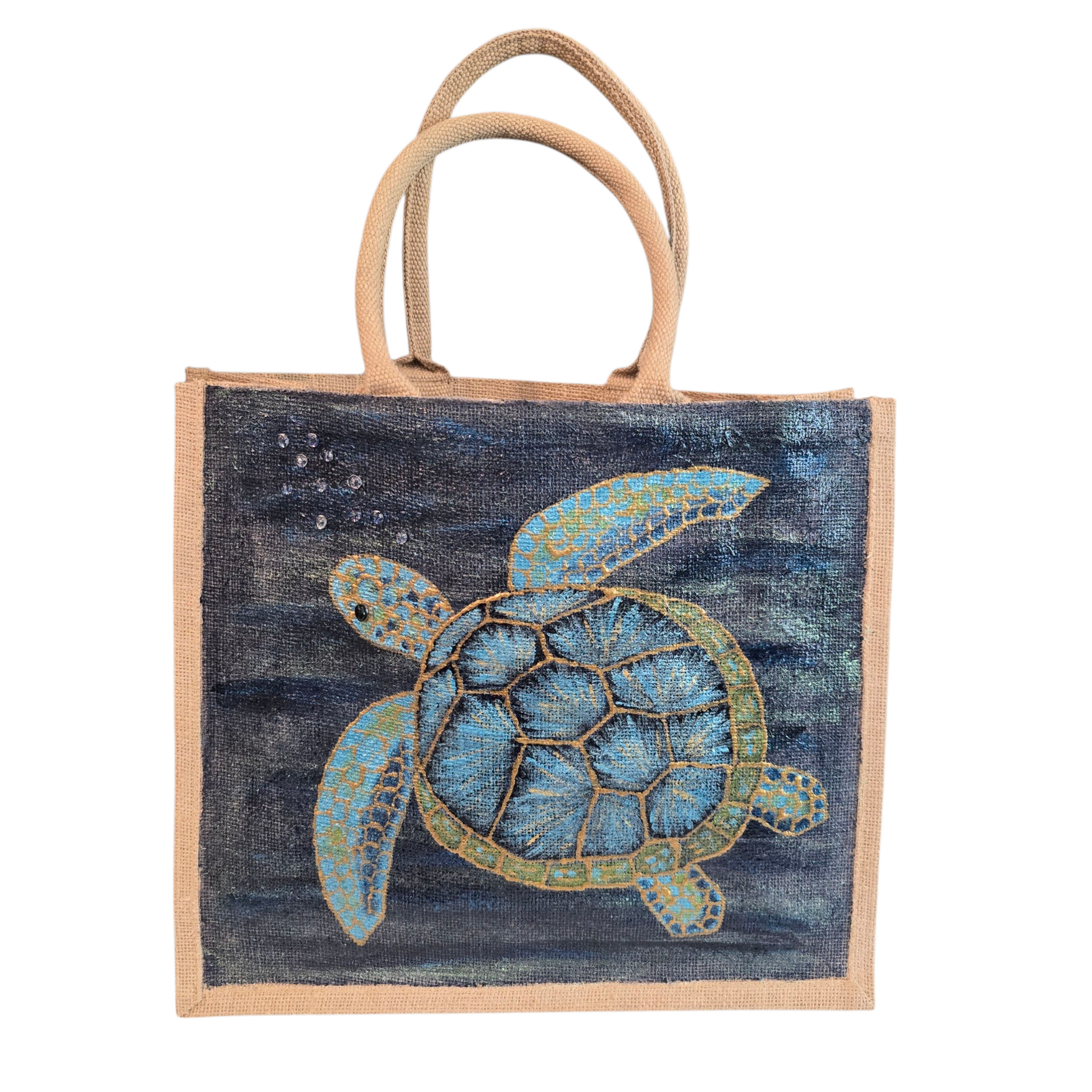 sea turtle hand-painted on burlap jute tote bag in blues, greens and golds on a navy metallic background.