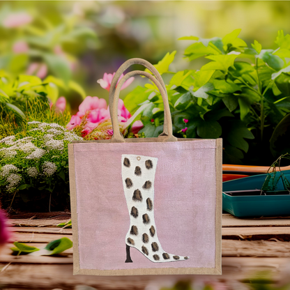 Cow Print Boot Tote Bag.  Brown, black and gold cow print on white boot set on metallic light pink background.