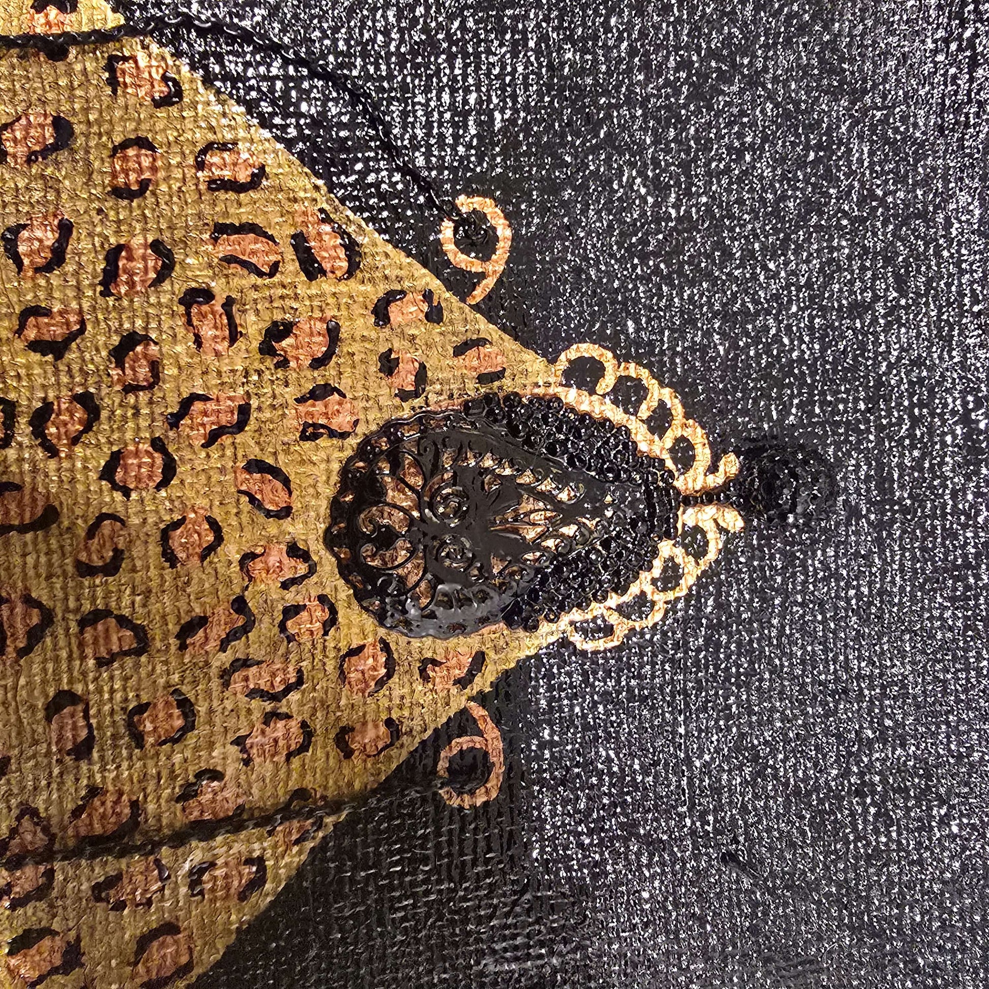 close up of Hand-painted black jute purse tote with gold leopard design and chain handles