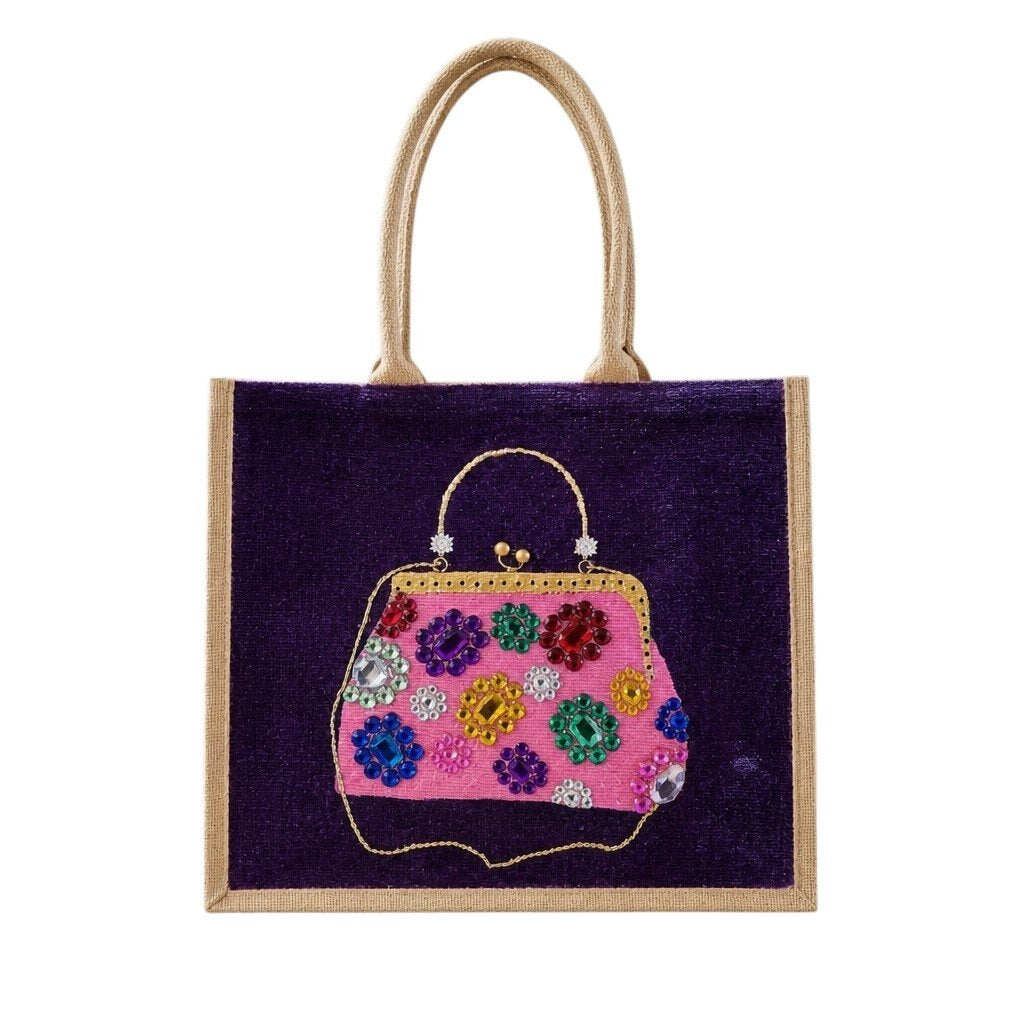 Hand-painted purple jute tote bag featuring an embellished pink vintage-style purse design with colorful jewel accents and dimensional details against a rich purple background. Fashion-inspired statement tote with natural jute trim, double handles, and magnetic snap closure. Perfect for boutique fashion lovers, dressy occasions, and unique handmade gift giving.