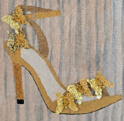 Hand-painted neutral-toned tote bag featuring an elegant gold high-heel sandal embellished with shimmering floral sequins on a soft gray and beige textured background. Stylish wearable art handbag with structured jute handles and sophisticated fashion-inspired design.