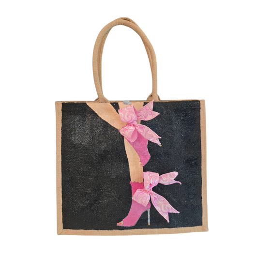 Hand-painted tote bag featuring a pink high heel with bows on a black background with dimensional ribbon accents