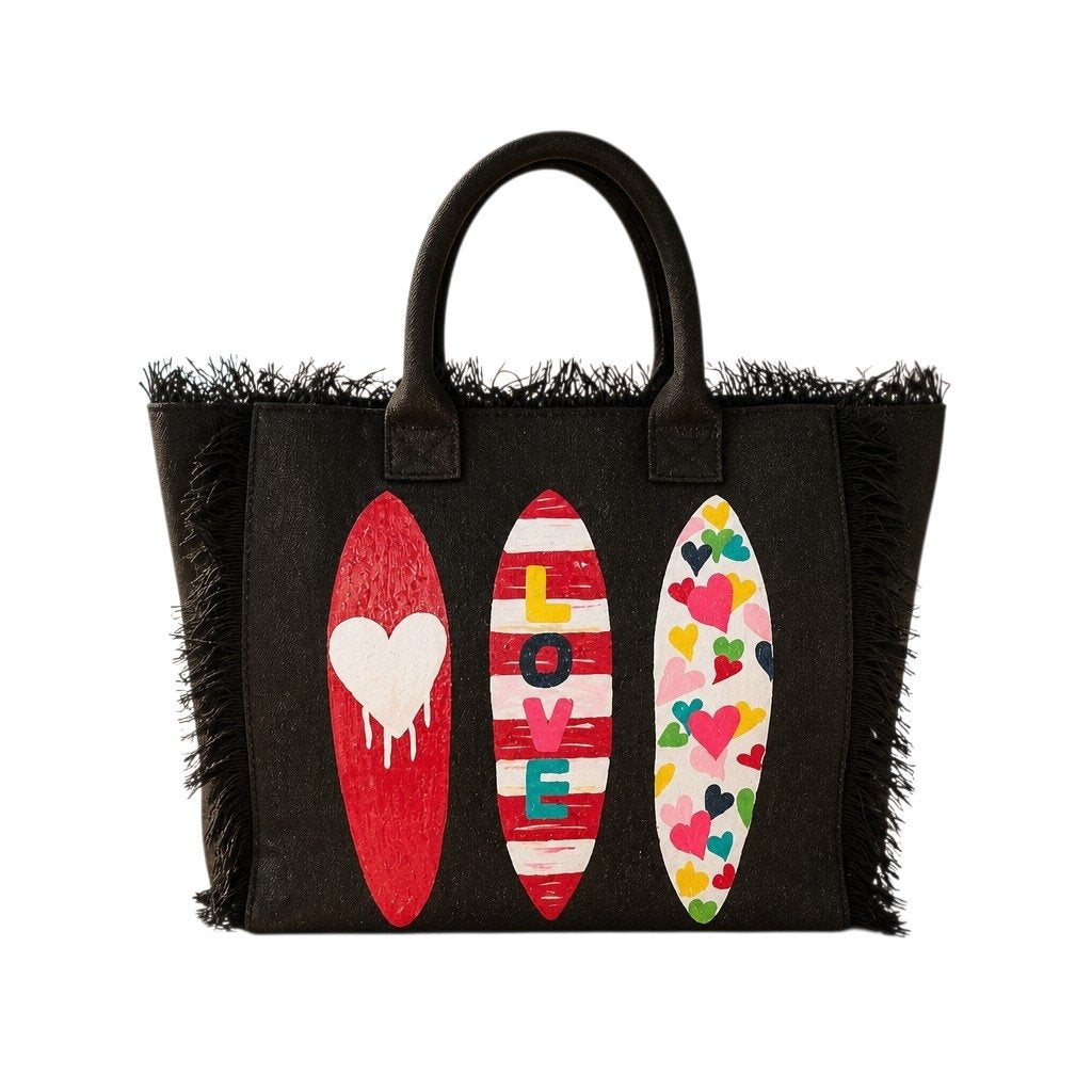 Hand-painted black fringed tote bag featuring three colorful surfboards with heart designs and the word “LOVE,” set against a neutral background.