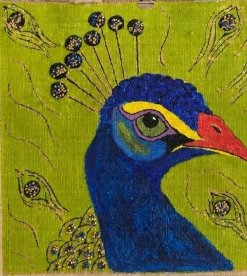 Close up of Hand-painted peacock tote bag on natural jute canvas featuring a bold blue peacock portrait with colorful feather accents against a vibrant lime green background, finished with long double handles and a structured rectangular shape.