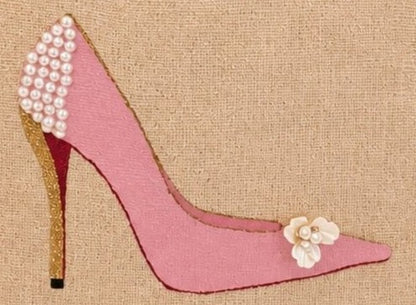 close up of Hand-painted pink stiletto tote bag on natural jute canvas featuring pearl embellishments on the heel, a gold glitter heel accent, and delicate floral detail on the toe.