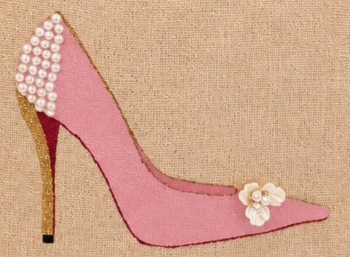 close up of Hand-painted pink stiletto tote bag on natural jute canvas featuring pearl embellishments on the heel, a gold glitter heel accent, and delicate floral detail on the toe.