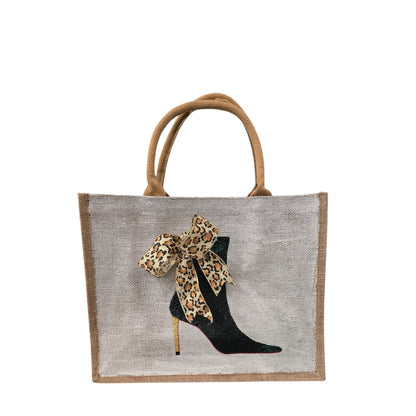 Off white jute tote bag with hand-painted black booties and red soles, featuring beaded embellishments.