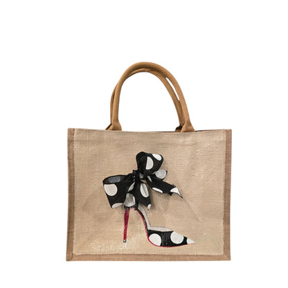 Off white jute tote bag with hand-painted black stilettos, white polka dots, red soles, and beaded accents.