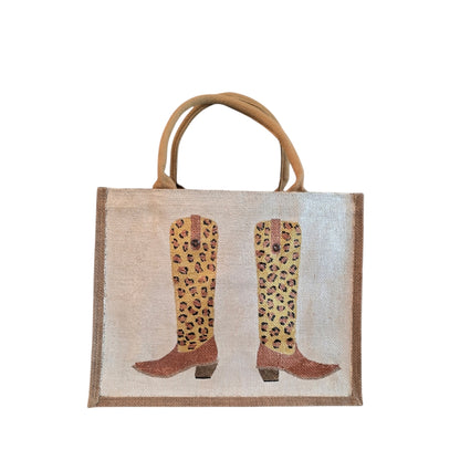 Off white jute tote bag with hand-painted leopard print cowboy boots, detailed with bead accents.