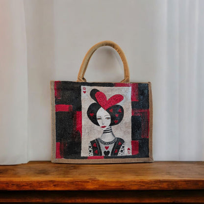 Black jute tote bag with hand-painted Queen of Hearts playing card design and decorative beading.