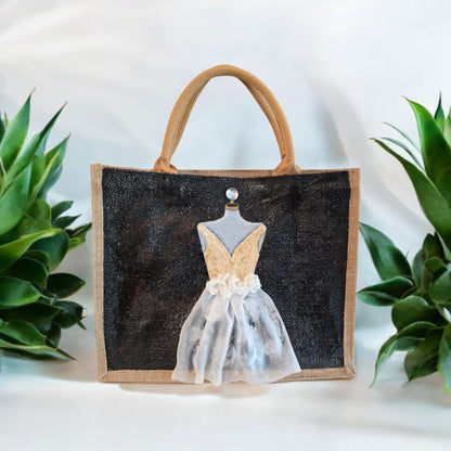 Black jute tote bag with hand-painted white wedding dress design and beaded embellishments.
