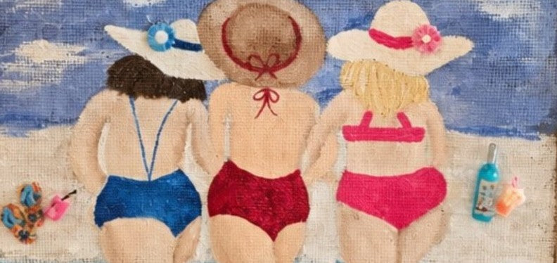 close up of Hand-painted beach girlfriends jute tote bag featuring three women walking into the ocean in colorful swimsuits, accented with beach accessories and a soft blue coastal background