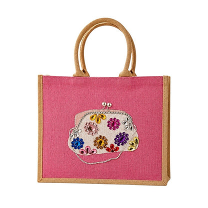 Hand-painted pink jute tote bag featuring a jeweled evening clutch design with colorful gem embellishments, bringing bold glamour and playful elegance to everyday fashion.